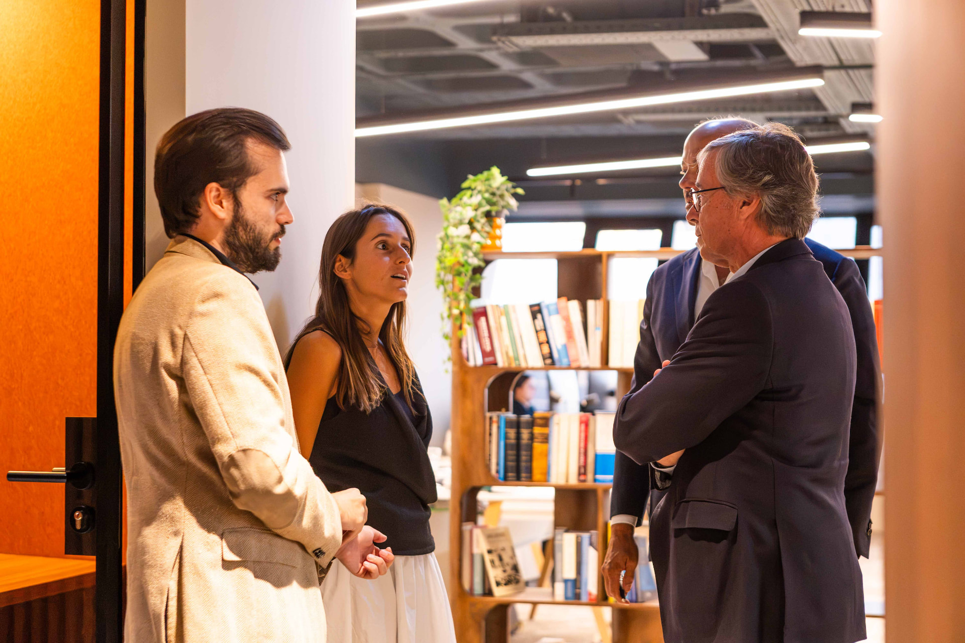 Participants and legal professionals in conversation during the LegalTech Hackathon at PaxRocket.